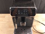 an image of a coffee machine on a wooden table