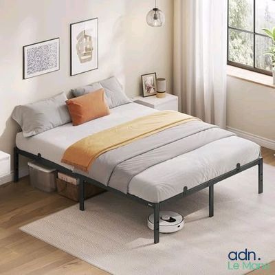 an image of a bedroom with a bed and a window