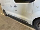 a white van that is parked in a parking lot