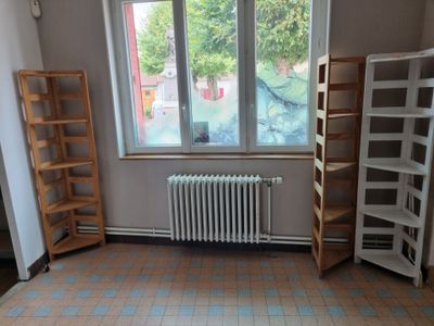 a room with a radiator and a window in it