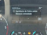 a close up of the dashboard of a car with a speedometer