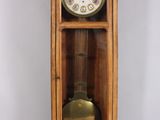 a clock that is sitting inside of a wooden case