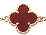 an image of a bracelet with a red stone in the middle