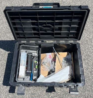 a black case with a bunch of items inside of it