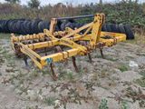 an image of a tractor plow in a field