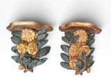 pair of carved wood wall sconces with flowers and leaves