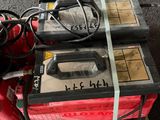 a red fire hydrant sitting on top of a pallet