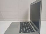 a laptop computer sitting on a table with a white background