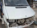 a white van that is sitting in the dirt