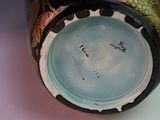 a close up of a vase on a table