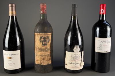 three bottles of wine are lined up on a table