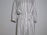 an image of a dress on a mannequin stand