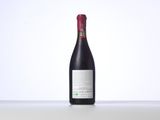 a bottle of red wine sitting on top of a table