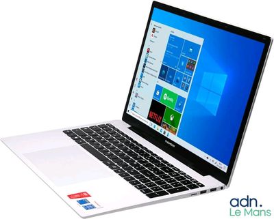 a laptop computer that is open on a white surface