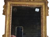 a person taking a picture of a mirror with a cell phone