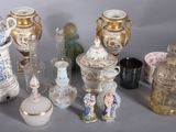 many different types of vases sitting on a table