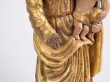 statue of a woman holding a child in her arms