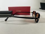 a pair of sunglasses sitting on a table next to a red box