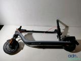 an electric scooter sitting on top of a white table