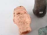 three pieces of clay sitting next to each other on a table