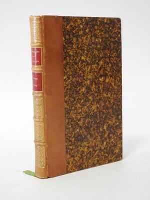 a close up of a book on a white surface with a white background