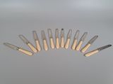 a lot of knives that are sitting on a table