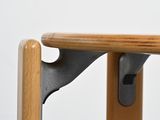 a close up of a wooden table with a metal handle
