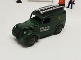 a green toy truck with a ladder on top of it