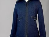 an image of a blue jacket on a mannequin