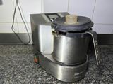 a blender that is sitting on the floor in the kitchen