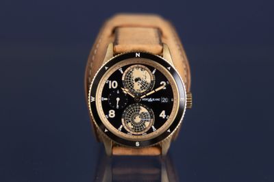 a watch that is sitting on a glass table