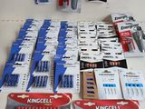 a lot of batteries that are on the table