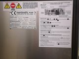 a picture of a stainless steel refrigerator with a warning sticker on it