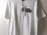 white t - shirt with black words on it hanging on a hanger