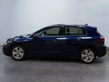 the blue car is parked in a white room with a gray floor
