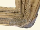 a picture of a gold frame with a picture on it