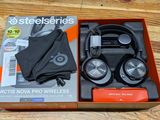 a box with headphones and an umbrella on the table