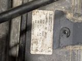 a close up of a car ' s engine with a sticker on it