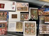 many cards and postcards on display in a glass case