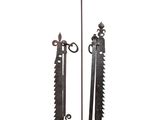 pair of antique iron garden tools on a white background
