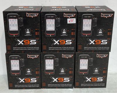 four boxes of cell phones are stacked on top of each other