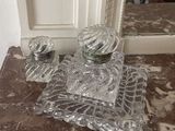 a picture of a glass vanity set on a marble counter top