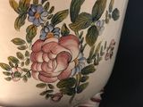 a large white bowl with a floral design on it