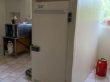 an image of a kitchen with a refrigerator in it