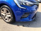 a blue car that is parked in a parking lot