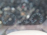 a car dashboard with a speedometer and gauges on it