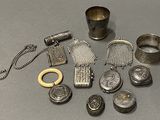 a lot of silver items that are on the table