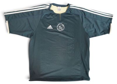 a close up of a shirt with a soccer logo on it