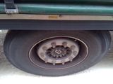 a close up of a flat tire on a truck