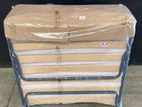 a stack of mattresses sitting on top of a pallet